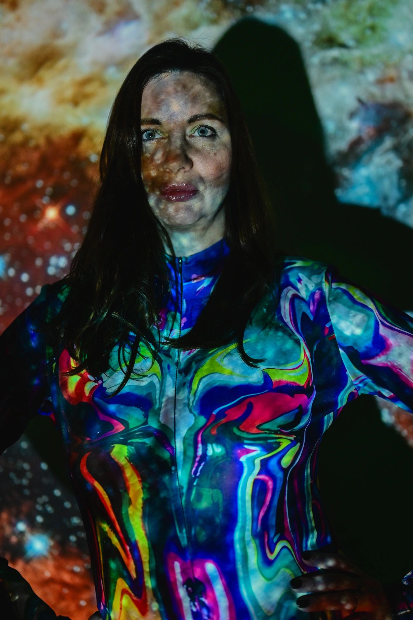 Creative portrait with galaxy light projection representing imaginative storytelling